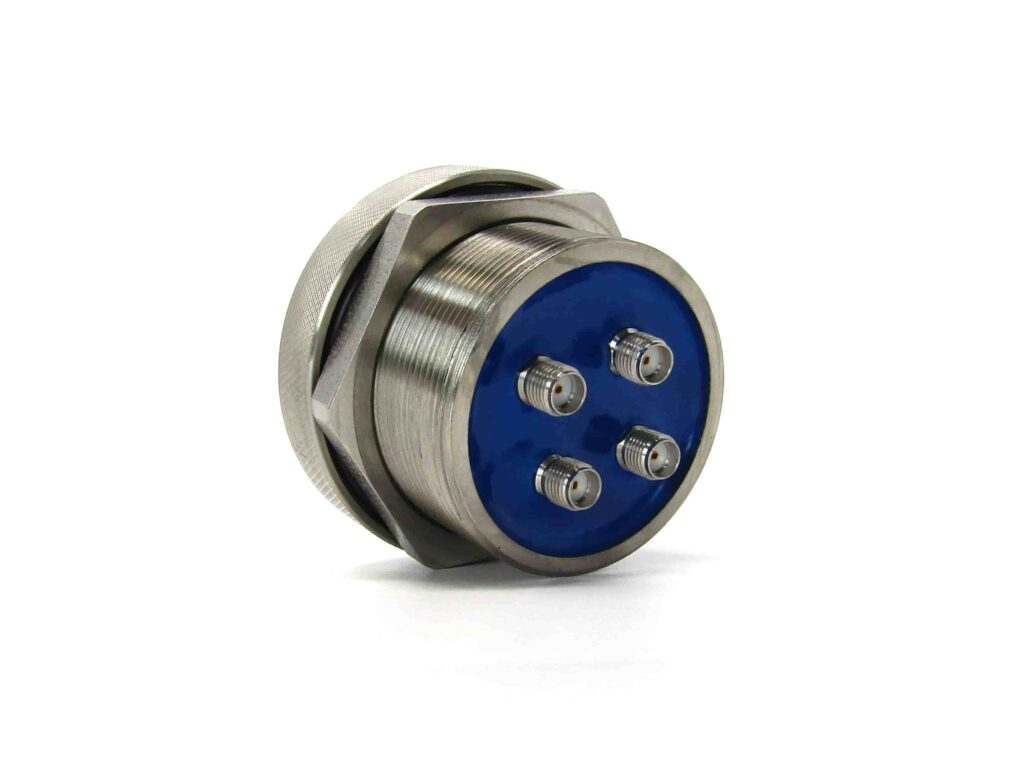 Hermetic SMA coaxial feedthrough with vacuum face seal interfaces and four connections